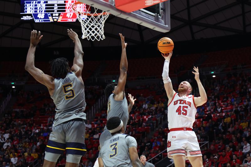 Mar 4, 2025; Salt Lake City, Utah, USA; Utah Utes guard Mason Madsen (45) takes a shot against the West Virginia Mountaineers during the second half at Jon M. Huntsman Center. Mandatory Credit: Rob Gray-Imagn Images