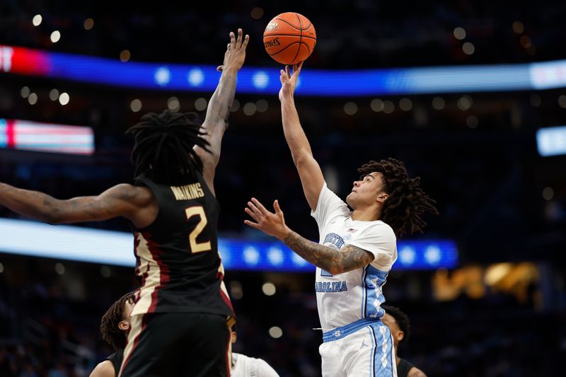 Mar 14, 2024; Washington, D.C., USA; North Carolina guard Elliot Cadeau (2) shoots the ball as Florida State forward Jamir Watkins (2) defends in the second half at Capital One Arena. Mandatory Credit: Geoff Burke-USA TODAY Sports