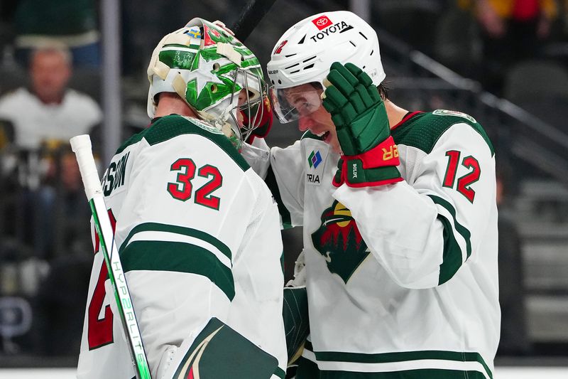 Feb 12, 2024; Las Vegas, Nevada, USA; Minnesota Wild left wing Matt Boldy (12) congratulates Minnesota Wild goaltender Filip Gustavsson (32) after the Wild defeated the Vegas Golden Knights 5-3 at T-Mobile Arena. Mandatory Credit: Stephen R. Sylvanie-USA TODAY Sports