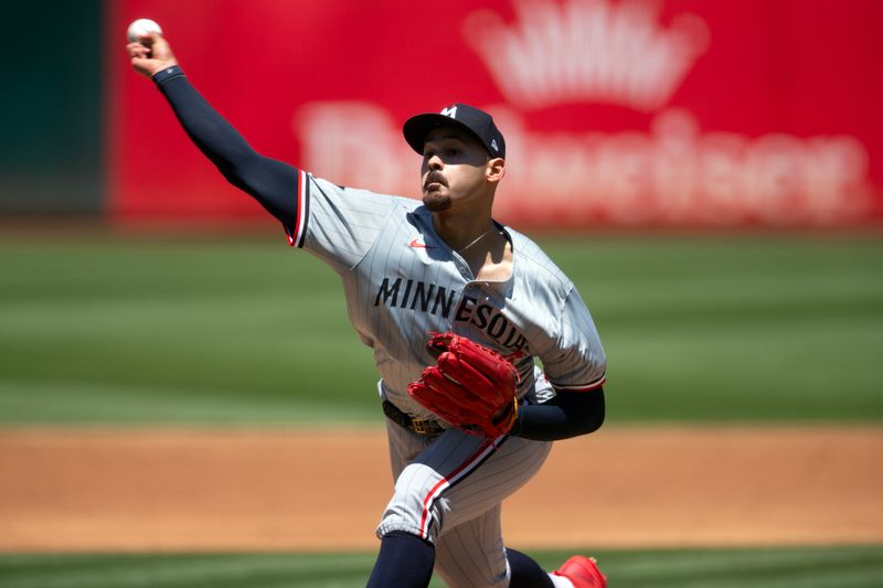 Jun 23, 2024; Oakland, California, USA; Minnesota Twins starting pitcher Pablo Lopez (49) delivers a pitch against the Oakland Athletics during the second inning at Oakland-Alameda County Coliseum. Mandatory Credit: D. Ross Cameron-USA TODAY Sports