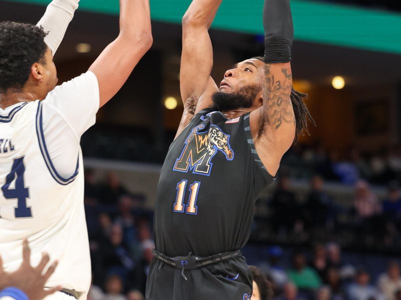 Feb 26, 2025; Memphis, Tennessee, USA; Memphis Tigers guard Tyrese Hunter (11) shoots against the Rice Owls during the first half at FedExForum. Mandatory Credit: Wesley Hale-Imagn Images