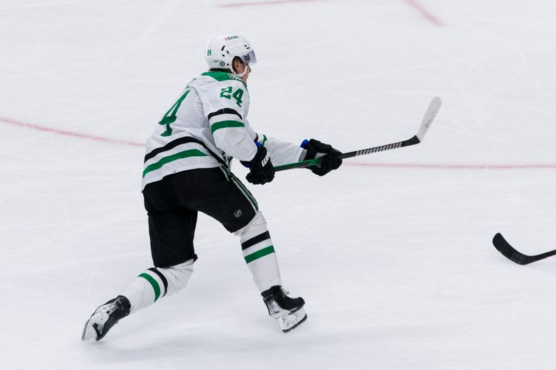 Mar 5, 2024; San Jose, California, USA; Dallas Stars left wing Jamie Benn (14) shoots and scores the winning goal against the San Jose Sharks during the first overtime period at SAP Center at San Jose. Mandatory Credit: John Hefti-USA TODAY Sports