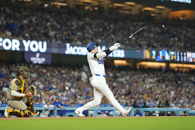 Sep 25, 2024; Los Angeles, California, USA; Los Angeles Dodgers designated hitter Shohei Ohtani (17) bats in the third inning against the San Diego Padres at Dodger Stadium. Mandatory Credit: Kirby Lee-Imagn Images