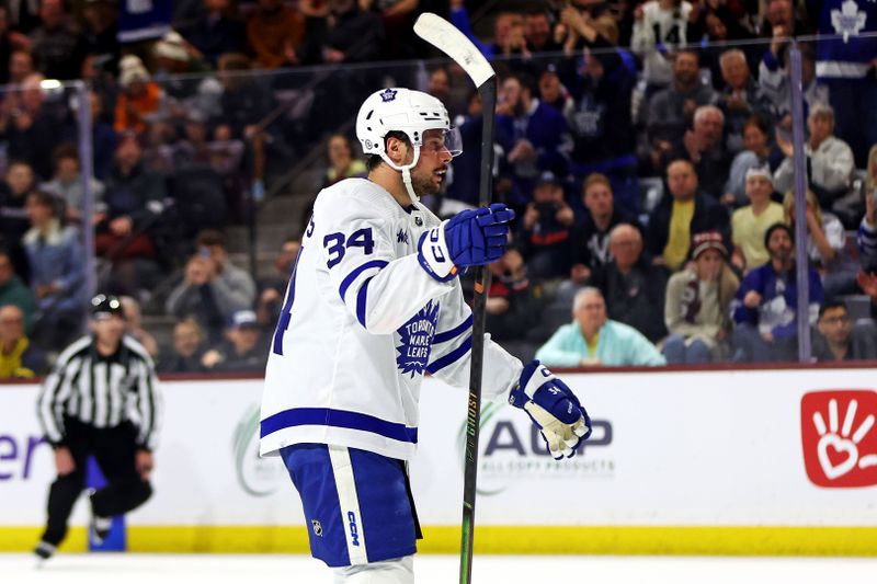 Feb 21, 2024; Tempe, Arizona, USA; Toronto Maple Leafs center Auston Matthews (34) celebrates after scoring a goal during the first period against the Arizona Coyotes at Mullett Arena. Mandatory Credit: Mark J. Rebilas-USA TODAY Sports