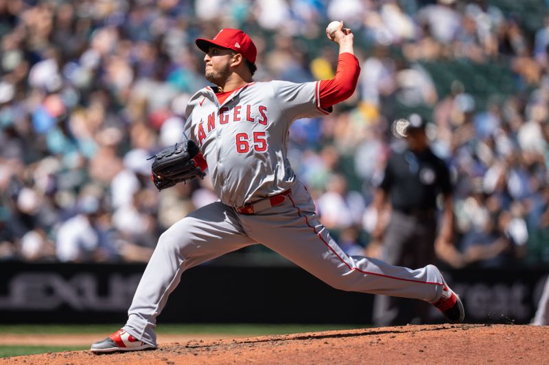 Jul 24, 2024; Seattle, Washington, USA;  Los Angeles Angels reliever José Quijada (65) delivers a pitch during the sixth inning against the Seattle Mariners at T-Mobile Park. Mandatory Credit: Stephen Brashear-USA TODAY Sports