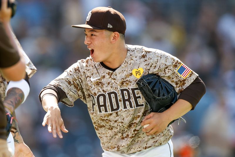 Aug 4, 2024; San Diego, California, USA; San Diego Padres relief pitcher Yuki Matsui (1) celebrates after the Padres defeat the Colorado Rockies 10-2 at Petco Park. Mandatory Credit: David Frerker-USA TODAY Sports