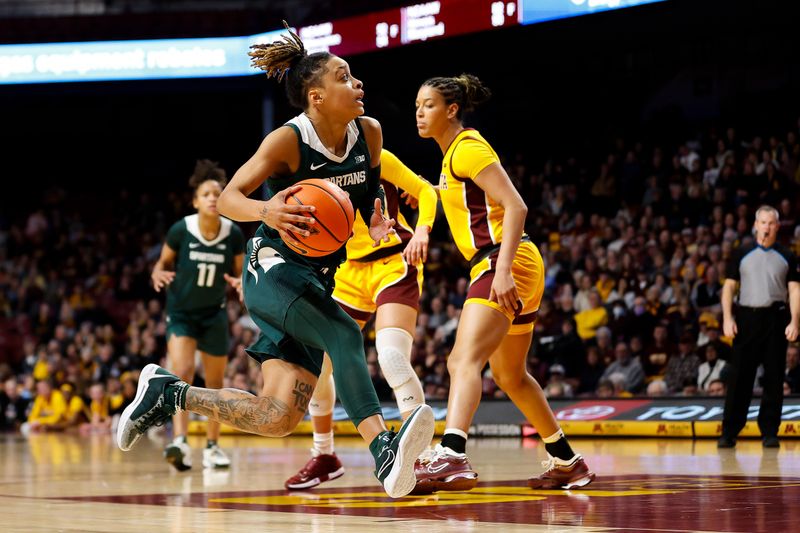 Jan 20, 2024; Minneapolis, Minnesota, USA; Michigan State Spartans guard DeeDee Hagemann (0) drives towards the basket against the Minnesota Golden Gophers during the second half at Williams Arena. Mandatory Credit: Matt Krohn-USA TODAY Sports