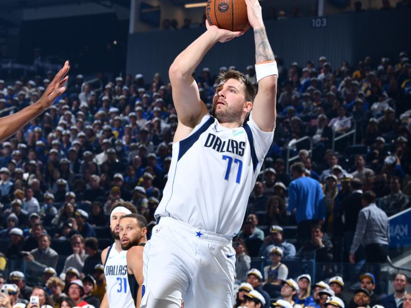 PHOENIX, AZ - NOVEMBER 12: Luka Doncic #77 of the Dallas Mavericks shoots the ball during the game against the Golden State Warriors during the Emirates NBA Cup game on November 12, 2024 at Footprint Center in Phoenix, Arizona. NOTE TO USER: User expressly acknowledges and agrees that, by downloading and or using this photograph, user is consenting to the terms and conditions of the Getty Images License Agreement. Mandatory Copyright Notice: Copyright 2024 NBAE (Photo by Barry Gossage/NBAE via Getty Images)