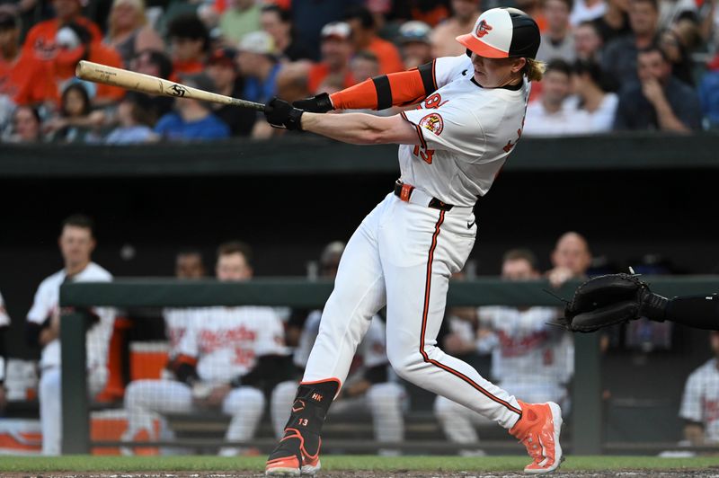 May 1, 2024; Baltimore, Maryland, USA;  Baltimore Orioles outfielder Heston Kjerstad (13) singles during the third inning against the New York Yankees at Oriole Park at Camden Yards. Mandatory Credit: Tommy Gilligan-USA TODAY Sports