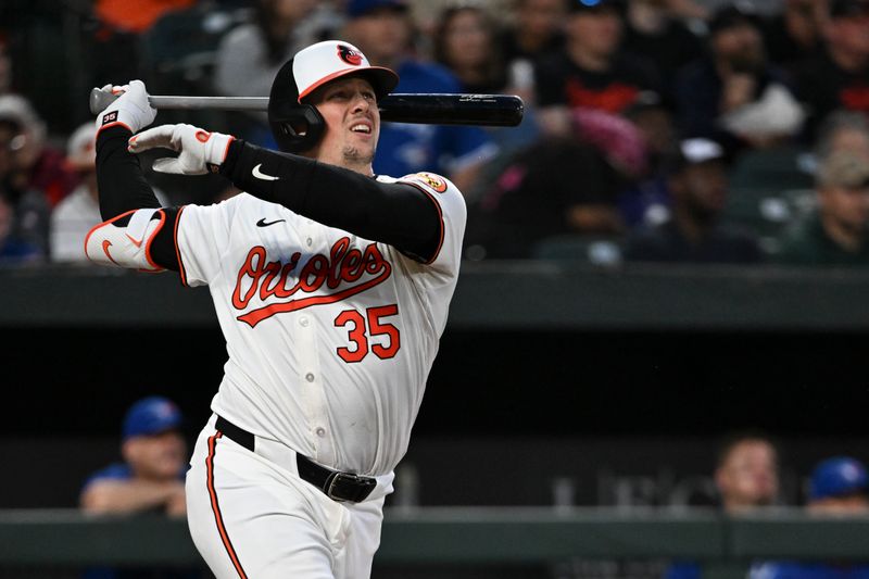 May 13, 2024; Baltimore, Maryland, USA;  Baltimore Orioles catcher Adley Rutschman (35) swings through  a sixth inning solo homerun against the Toronto Blue Jays at Oriole Park at Camden Yards. Mandatory Credit: Tommy Gilligan-USA TODAY Sports