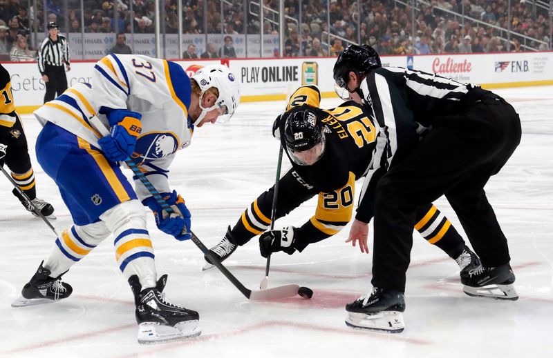 Jan 6, 2024; Pittsburgh, Pennsylvania, USA;  Buffalo Sabres center Casey Mittelstadt (37) wins a face-off against Pittsburgh Penguins center Lars Eller (20) during the first period at PPG Paints Arena. Mandatory Credit: Charles LeClaire-USA TODAY Sports