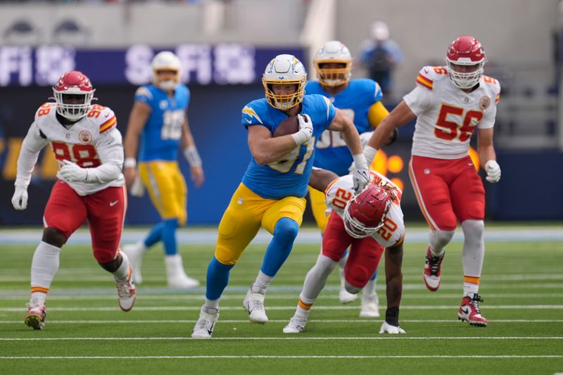 Los Angeles Chargers tight end Will Dissly runs with the ball during the first half of an NFL football game against the Kansas City Chiefs Sunday, Sept. 29, 2024, in Inglewood, Calif. (AP Photo/Marcio Jose Sanchez)