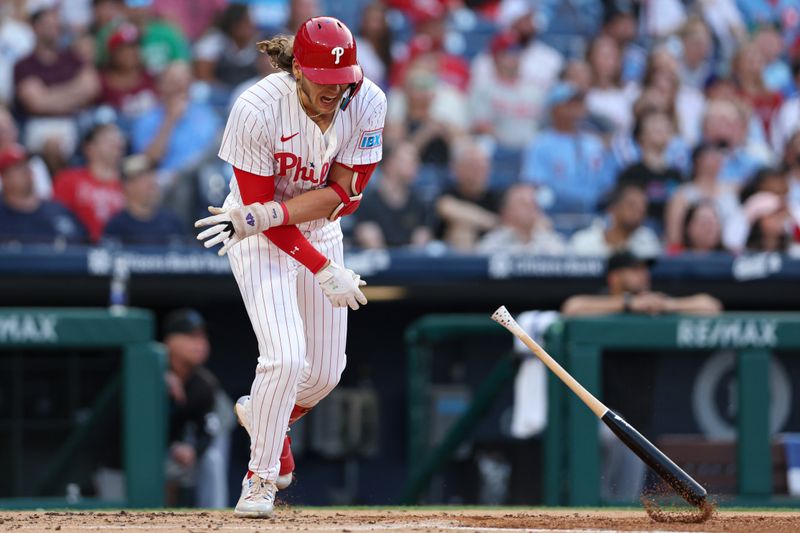 Aug 14, 2024; Philadelphia, Pennsylvania, USA; Philadelphia Phillies third base Alec Bohm (28) slams his bat in reaction to popping out to end the first inning against the Miami Marlins at Citizens Bank Park. Mandatory Credit: Bill Streicher-USA TODAY Sports