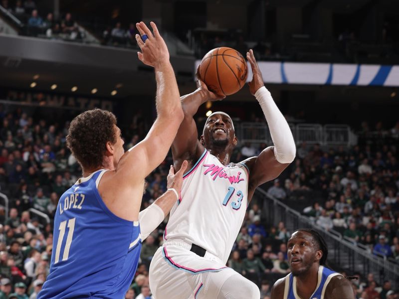 MILWAUKEE, WI - FEBRUARY 23:  Bam Adebayo #13 of the Miami Heat shoots the ball during the game against the Milwaukee Bucks on February 23, 2025 at Fiserv Forum Center in Milwaukee, Wisconsin. NOTE TO USER: User expressly acknowledges and agrees that, by downloading and or using this Photograph, user is consenting to the terms and conditions of the Getty Images License Agreement. Mandatory Copyright Notice: Copyright 2025 NBAE (Photo by Gary Dineen/NBAE via Getty Images).