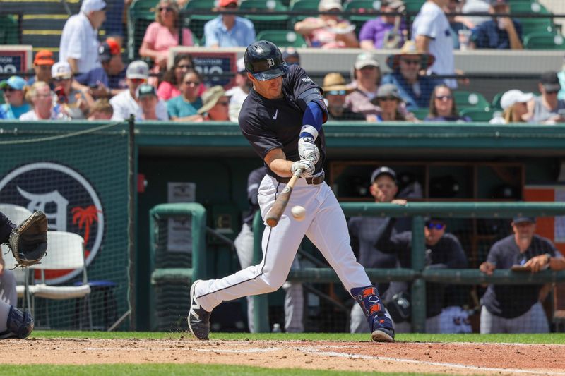 Mar 23, 2024; Lakeland, Florida, USA; Detroit Tigers first baseman Mark Canha (21) bats during the third inning against the New York Yankees at Publix Field at Joker Marchant Stadium. Mandatory Credit: Mike Watters-USA TODAY Sports