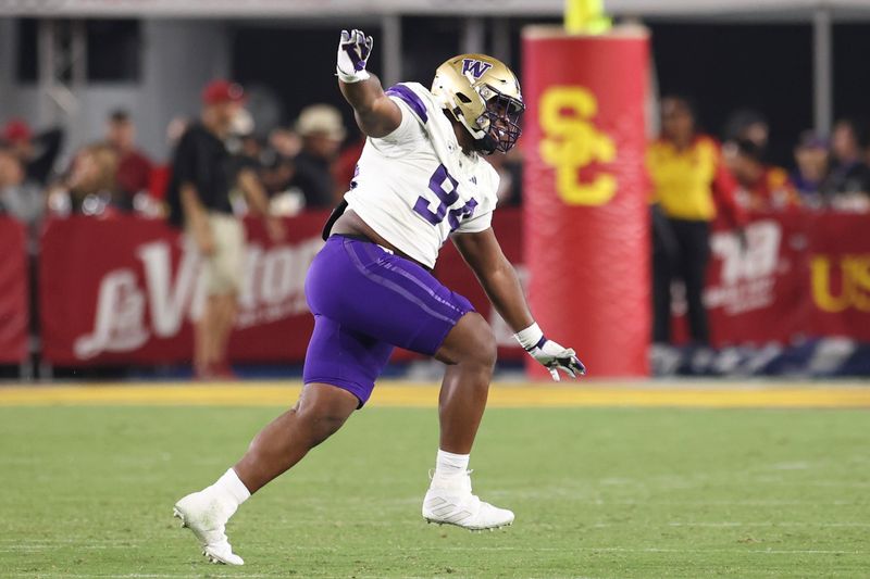 Nov 4, 2023; Los Angeles, California, USA; Washington Huskies defensive lineman Jayvon Parker (94) celebrates after the Washington Huskies defeat the USC Trojans at United Airlines Field at Los Angeles Memorial Coliseum. Mandatory Credit: Jessica Alcheh-USA TODAY Sports