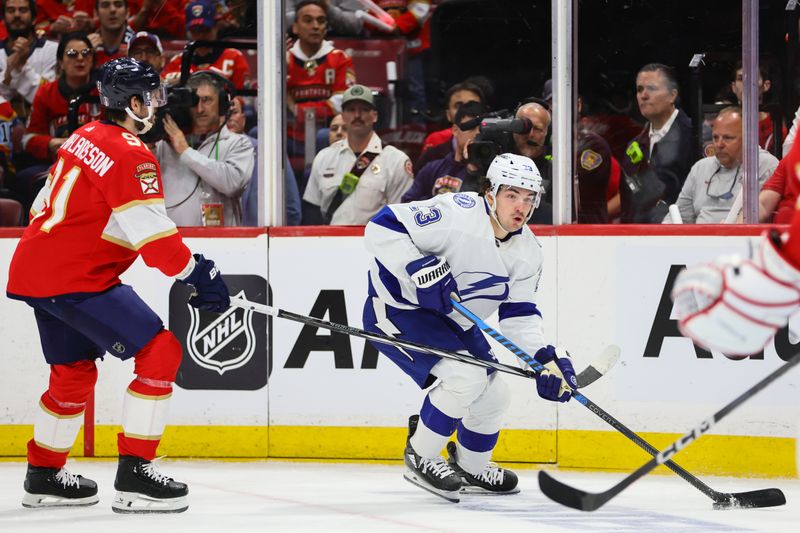 Apr 21, 2024; Sunrise, Florida, USA; Tampa Bay Lightning center Michael Eyssimont (23) moves the puck against the Florida Panthers during the second period in game one of the first round of the 2024 Stanley Cup Playoffs at Amerant Bank Arena. Mandatory Credit: Sam Navarro-USA TODAY Sports