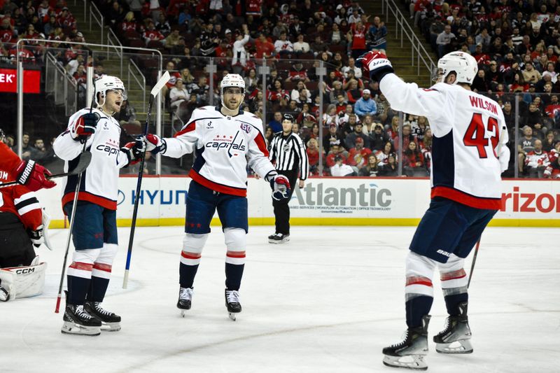 Oct 19, 2024; Newark, New Jersey, USA; Washington Capitals center Connor McMichael (24) reacts after scoring a goal against the New Jersey Devils during the first period at Prudential Center. Mandatory Credit: John Jones-Imagn Images