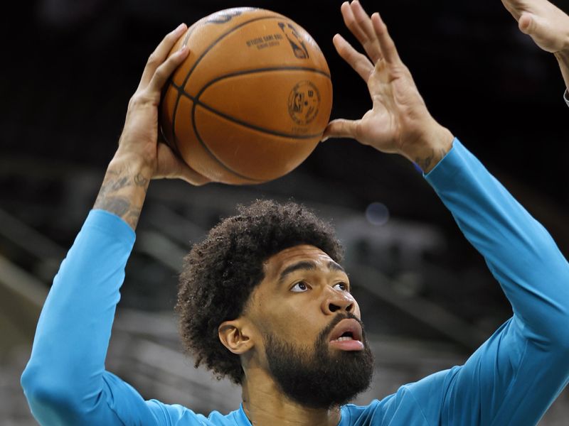 SAN ANTONIO, TX - JANUARY  12:   Nick Richards #4 of the Charlotte Hornets takes warm up shots before their game against the San Antonio Spurs at Frost Bank Center on January 12, 2024 in San Antonio, Texas. NOTE TO USER: User expressly acknowledges and agrees that, by downloading and or using this photograph, User is consenting to terms and conditions of the Getty Images License Agreement. (Photo by Ronald Cortes/Getty Images)