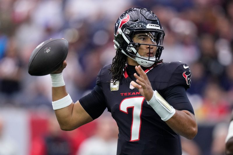 Houston Texans quarterback C.J. Stroud (7) looks to throw a pass during the first half of an NFL football game against the Tennessee Titans, Sunday, Nov. 24, 2024, in Houston. (AP Photo/Eric Christian Smith)