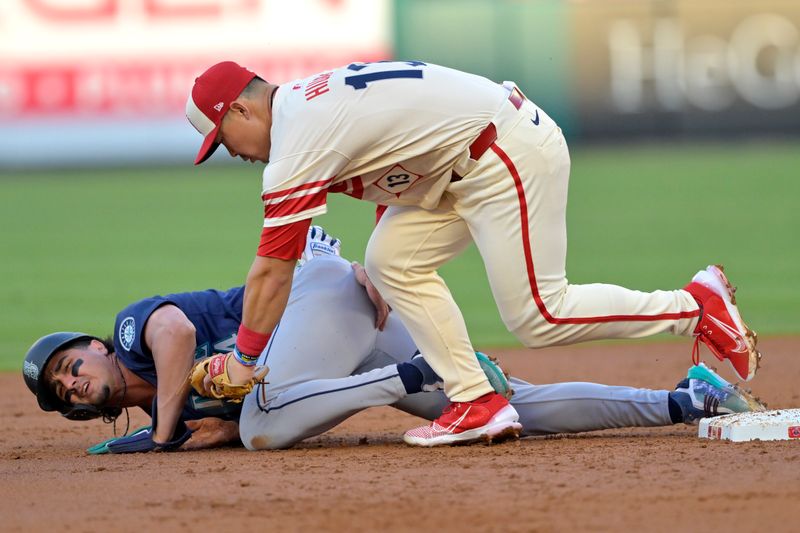 Jul 13, 2024; Anaheim, California, USA;  Josh Rojas #4 of the Seattle Mariners is caught stealing on tag by Keston Hiura #13 of the Los Angeles Angels in the second inning at Angel Stadium. Mandatory Credit: Jayne Kamin-Oncea-USA TODAY Sports