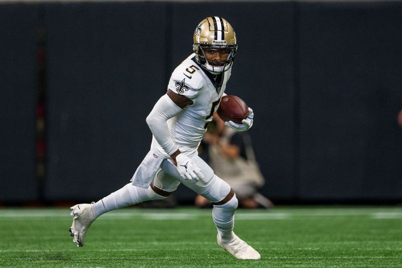 New Orleans Saints wide receiver Jarvis Landry (5) runs the ball during the first half of an NFL football game against the Atlanta Falcons, Sunday, Sep. 11, 2022, in Atlanta. The New Orleans Saints won 27-26. (AP Photo/Danny Karnik)