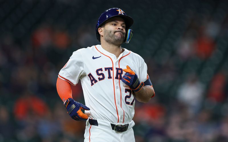 May 16, 2024; Houston, Texas, USA; Houston Astros second baseman Jose Altuve (27) reacts after a play during the second inning against the Oakland Athletics at Minute Maid Park. Mandatory Credit: Troy Taormina-USA TODAY Sports