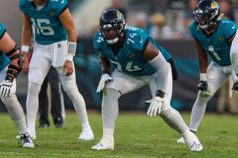 Jacksonville Jaguars offensive tackle Cam Robinson (74) in action during an NFL pre-season football game against the Miami Dolphins, Saturday, Aug. 26, 2023, in Jacksonville, Fla. The Jaguars defeated the Dolphins 31-18. (AP Photo/Gary McCullough)