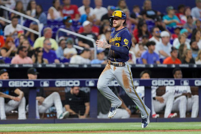 Sep 24, 2023; Miami, Florida, USA; Milwaukee Brewers second baseman Brice Turang (2) runs toward home plate and scores against the Miami Marlins during the fifth inning at loanDepot Park. Mandatory Credit: Sam Navarro-USA TODAY Sports