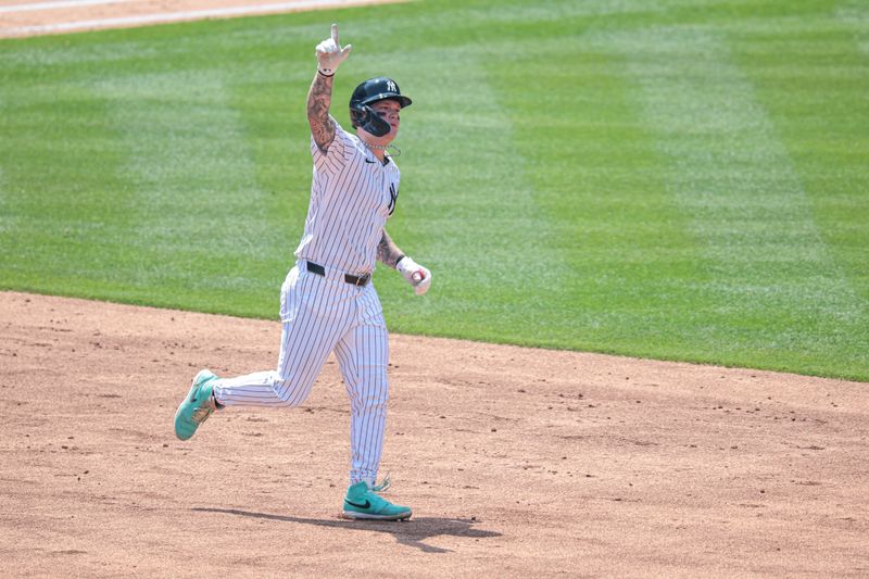 Jul 6, 2024; Bronx, New York, USA; New York Yankees left fielder Alex Verdugo (24) celebrates while running the bases during his two run home run during the third inning against the Boston Red Sox at Yankee Stadium. Mandatory Credit: Vincent Carchietta-USA TODAY Sports
