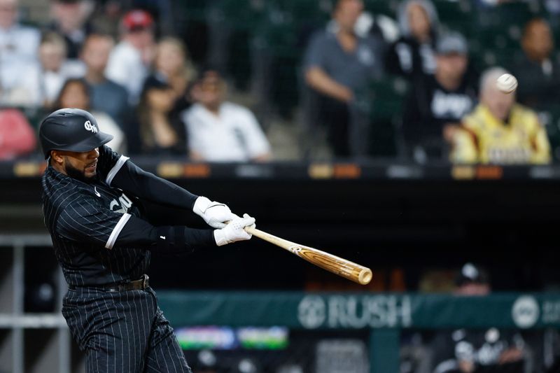 Sep 15, 2023; Chicago, Illinois, USA; Chicago White Sox shortstop Elvis Andrus (21) hits a two-run home run against the Minnesota Twins during the fifth inning at Guaranteed Rate Field. Mandatory Credit: Kamil Krzaczynski-USA TODAY Sports