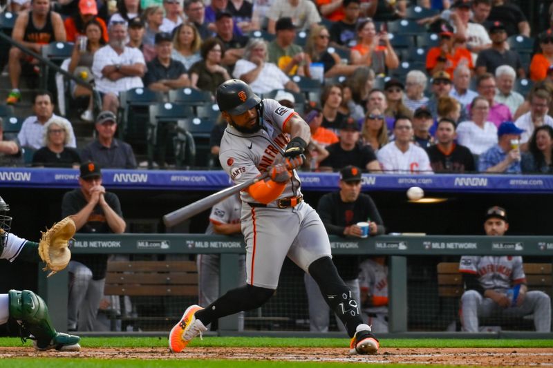 Jul 20, 2024; Denver, Colorado, USA; San Francisco Giants outfielder Heliot Ramos (17) gets a base hit against the Colorado Rockies in the fourth inning at Coors Field. Mandatory Credit: John Leyba-USA TODAY Sports