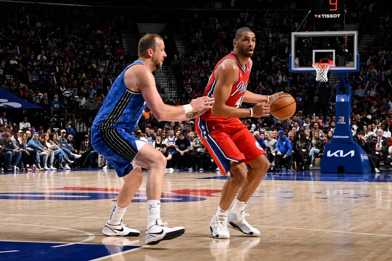 PHILADELPHIA, PA - APRIL 12: Nicolas Batum #40 of the Philadelphia 76ers dribbles the ball during the game against the Orlando Magic on April 12, 2024 at the Wells Fargo Center in Philadelphia, Pennsylvania NOTE TO USER: User expressly acknowledges and agrees that, by downloading and/or using this Photograph, user is consenting to the terms and conditions of the Getty Images License Agreement. Mandatory Copyright Notice: Copyright 2024 NBAE (Photo by David Dow/NBAE via Getty Images)