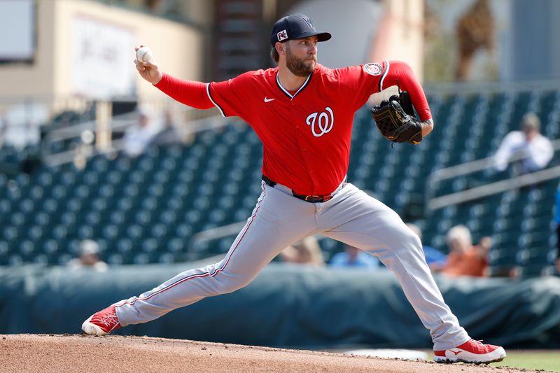 Feb 25, 2025; Jupiter, Florida, USA;  Washington Nationals starting pitcher Trevor Williams (32) throws against the Miami Marlins during the first inning at Roger Dean Chevrolet Stadium. Mandatory Credit: Rhona Wise-Imagn Image 