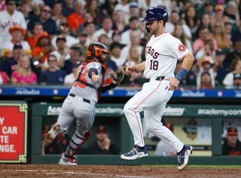 Jun 23, 2024; Houston, Texas, USA;  Houston Astros catcher Cesar Salazar (18) scores on a sacrifice fly against he Baltimore Orioles in the fourth inning at Minute Maid Park. Mandatory Credit: Thomas Shea-USA TODAY Sports