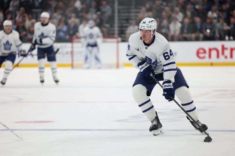 Mar 10, 2025; Salt Lake City, Utah, USA; Toronto Maple Leafs center David Kampf (64) skates with the puck against the Utah Hockey Club during the second period at Delta Center. Mandatory Credit: Rob Gray-Imagn Images