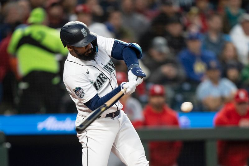 Apr 21, 2023; Seattle, Washington, USA; Seattle Mariners right fielder Teoscar Hernandez (35) hits a solo home run during the fourth inning against the St. Louis Cardinals at T-Mobile Park. Mandatory Credit: Stephen Brashear-USA TODAY Sports