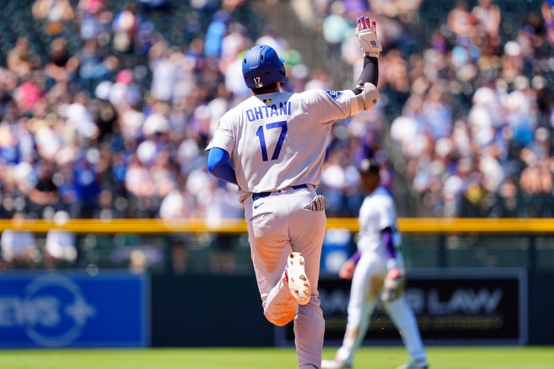 Jun 26, 2025; Denver, Colorado, USA; Los Angeles Dodgers designated hitter  Shohei Ohtani (17) runs the bases after a solo home run in the seventh inning against the Colorado Rockies at Coors Field. Mandatory Credit: Ron Chenoy-Imagn Images
