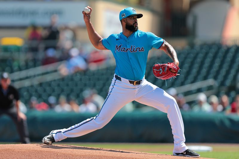 Feb 28, 2025; Jupiter, Florida, USA; Miami Marlins starting pitcher Sandy Alcantara (22) delivers a pitch against the Atlanta Braves during the first inning at Roger Dean Chevrolet Stadium. Mandatory Credit: Sam Navarro-Imagn Images