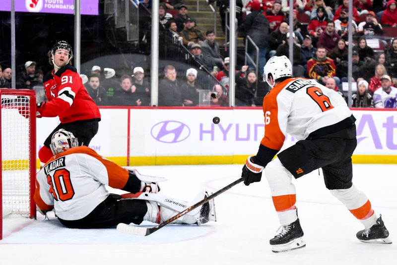 Nov 29, 2025; Newark, New Jersey, USA; Philadelphia Flyers goaltender Dan Vladar (80) makes a save against the New Jersey Devils during the second period at Prudential Center. Mandatory Credit: John Jones-Imagn Images