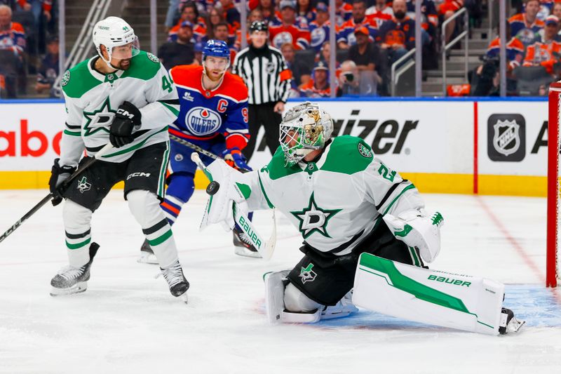 May 27, 2025; Edmonton, Alberta, CAN; Dallas Stars goaltender Jake Oettinger (29) makes a save as defenseman Cody Ceci (44) and Edmonton Oilers center Connor McDavid (97) looks on during the third period in game four of the Western Conference Final of the 2025 Stanley Cup Playoffs at Rogers Place. Mandatory Credit: Perry Nelson-Imagn Images