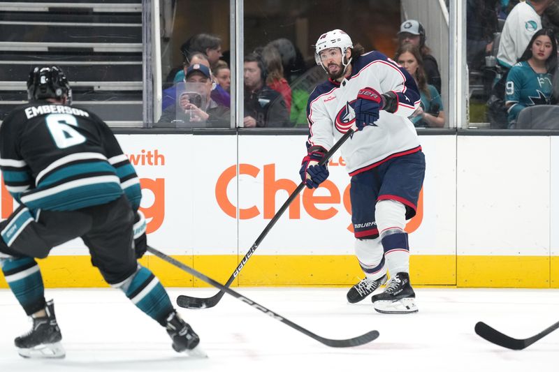 Feb 17, 2024; San Jose, California, USA; Columbus Blue Jackets defenseman Zach Werenski (8) passes against San Jose Sharks defenseman Ty Emberson (6) during the first period at SAP Center at San Jose. Mandatory Credit: Darren Yamashita-USA TODAY Sports