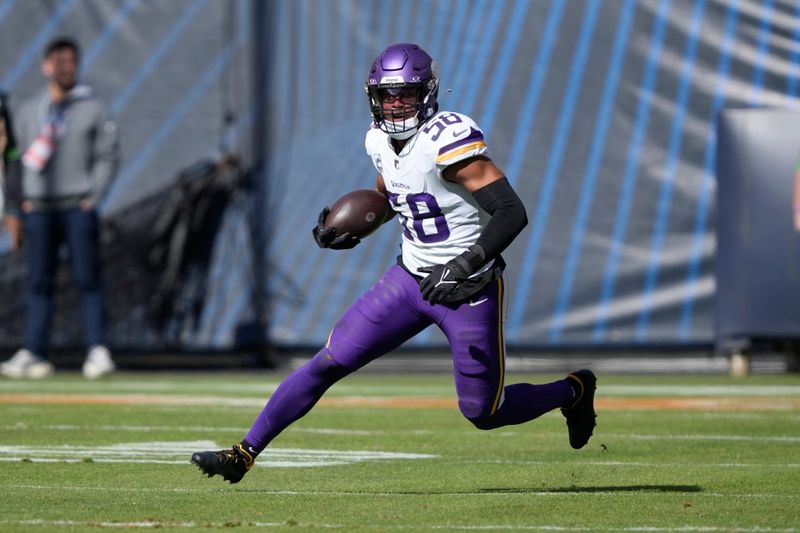 Minnesota Vikings linebacker Jordan Hicks (58) intercepts a pass from Chicago Bears quarterback Justin Fields during the first half of an NFL football game, Sunday, Oct. 15, 2023, in Chicago. (AP Photo/Charles Rex Arbogast)