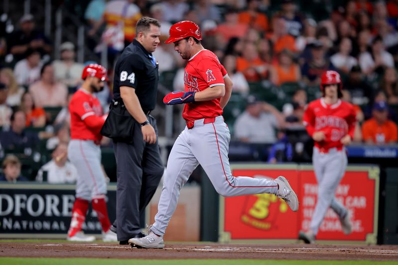 May 20, 2024; Houston, Texas, USA; Los Angeles Angels first base Nolan Schanuel (18) crosses home plate to score a run against the Houston Astros during the first inning at Minute Maid Park. Mandatory Credit: Erik Williams-USA TODAY Sports