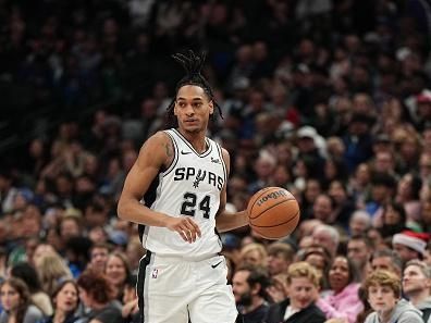 DALLAS, TX - DECEMBER 23: Devin Vassell #24 of the San Antonio Spurs dribbles the ball during the game against the Dallas Mavericks on December 23, 2023 at the American Airlines Center in Dallas, Texas. NOTE TO USER: User expressly acknowledges and agrees that, by downloading and or using this photograph, User is consenting to the terms and conditions of the Getty Images License Agreement. Mandatory Copyright Notice: Copyright 2023 NBAE (Photo by Glenn James/NBAE via Getty Images)