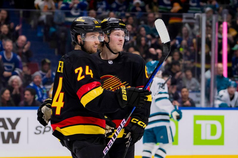 Dec 23, 2023; Vancouver, British Columbia, CAN; Vancouver Canucks forward Pius Suter (24) and forward Brock Boeser (6) celebrate Suter   s goal against the San Jose Sharks in the third period at Rogers Arena. Canucks won 7-4. Mandatory Credit: Bob Frid-USA TODAY Sports