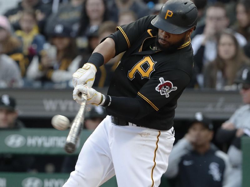 Apr 8, 2023; Pittsburgh, Pennsylvania, USA;  Pittsburgh Pirates first baseman Carlos Santana (41) hits an RBI single against the Pittsburgh Pirates during the first inning at PNC Park. Mandatory Credit: Charles LeClaire-USA TODAY Sports