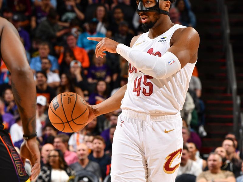 PHOENIX, AZ - APRIL 3:  Donovan Mitchell #45 of the Cleveland Cavaliers handles the ball during the game  on April 3, 2024 at Footprint Center in Phoenix, Arizona. NOTE TO USER: User expressly acknowledges and agrees that, by downloading and or using this photograph, user is consenting to the terms and conditions of the Getty Images License Agreement. Mandatory Copyright Notice: Copyright 2024 NBAE (Photo by Barry Gossage/NBAE via Getty Images)