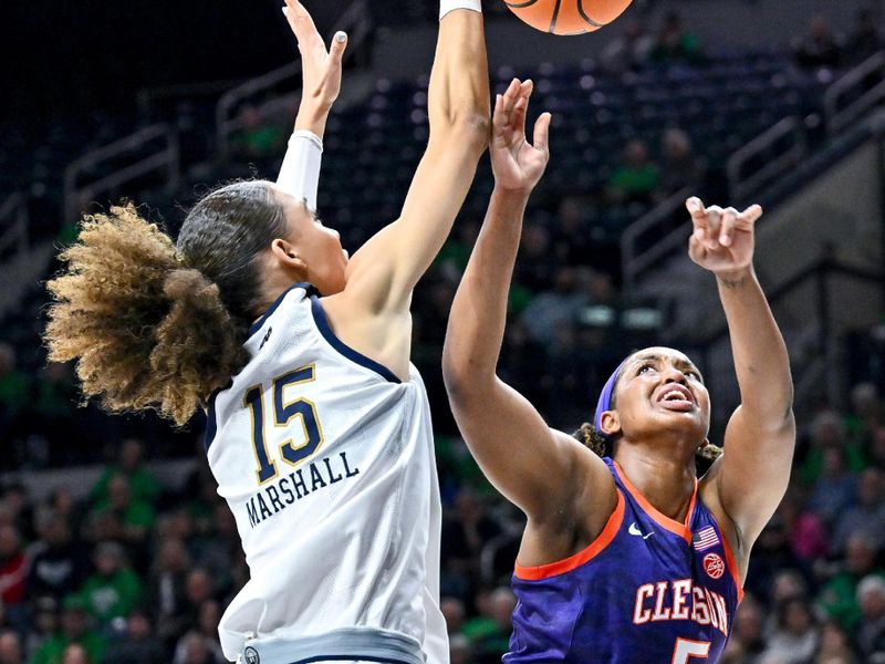 Feb 22, 2024; South Bend, Indiana, USA; Notre Dame Fighting Irish forward Nat Marshall (15) blocks the shot attempt by Clemson Tigers forward Amari Robinson (5) in the first half at the Purcell Pavilion. Mandatory Credit: Matt Cashore-USA TODAY Sports