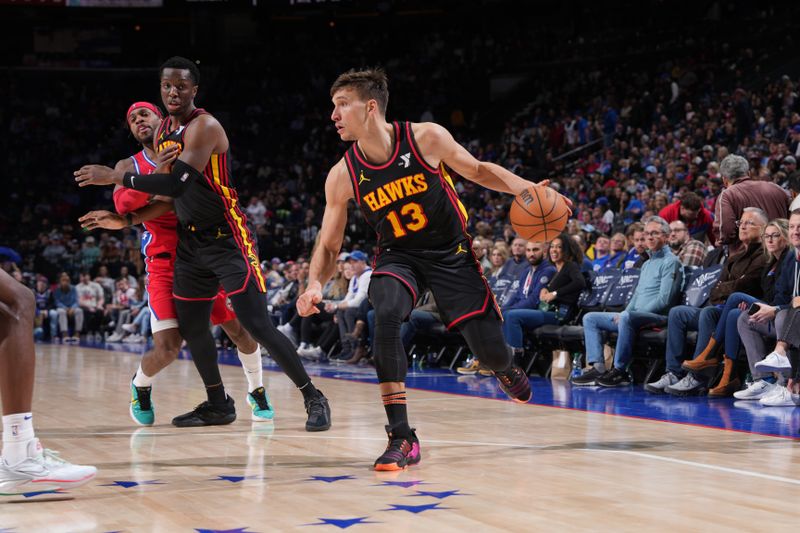 PHILADELPHIA, PA - FEBRUARY 9: Bogdan Bogdanovic #13 of the Atlanta Hawks dribbles the ball during the game against the Philadelphia 76ers on February 9, 2024 at the Wells Fargo Center in Philadelphia, Pennsylvania NOTE TO USER: User expressly acknowledges and agrees that, by downloading and/or using this Photograph, user is consenting to the terms and conditions of the Getty Images License Agreement. Mandatory Copyright Notice: Copyright 2024 NBAE (Photo by Jesse D. Garrabrant/NBAE via Getty Images)